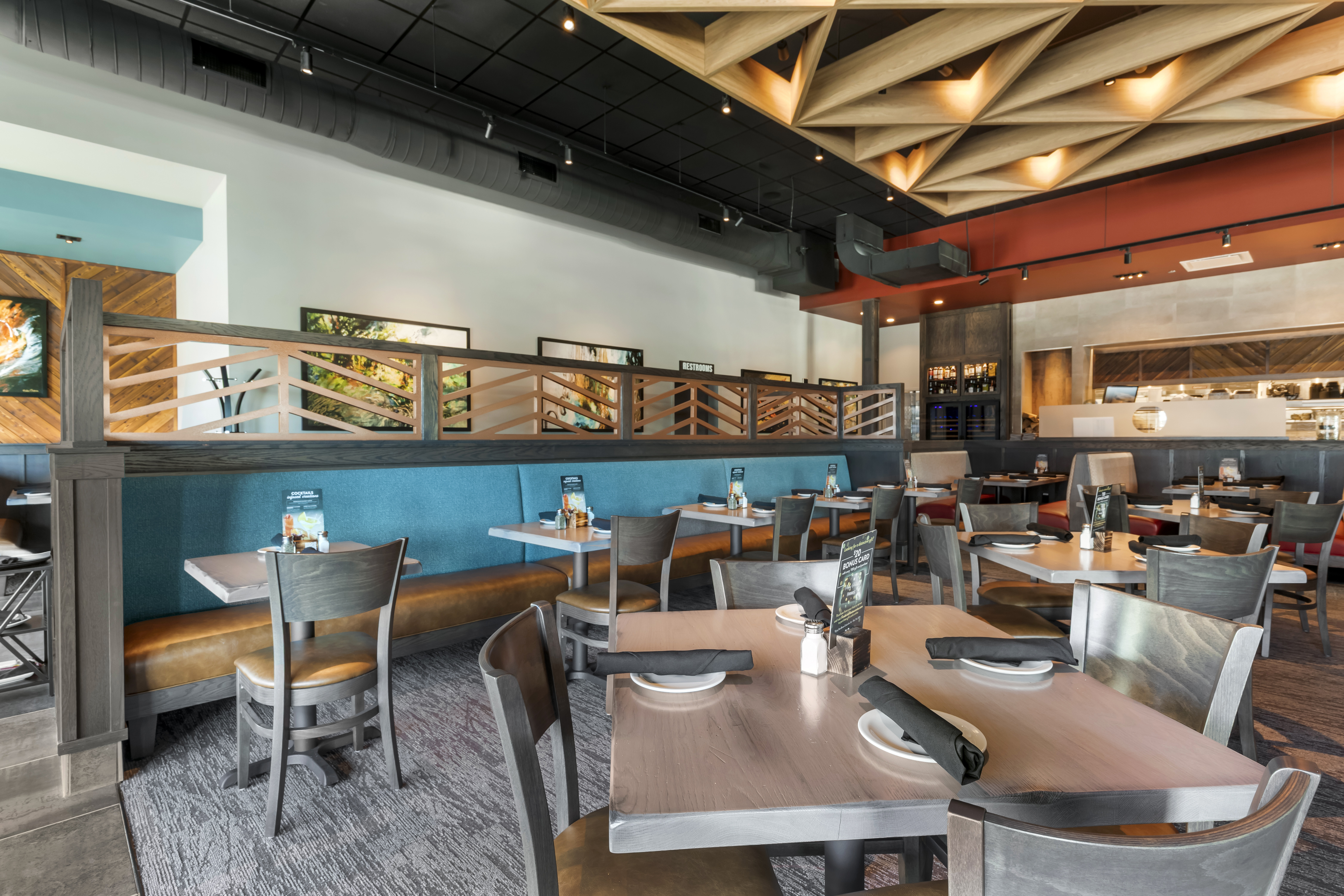 The exterior of Firebirds Wood Fired Grill Rogerslocation.